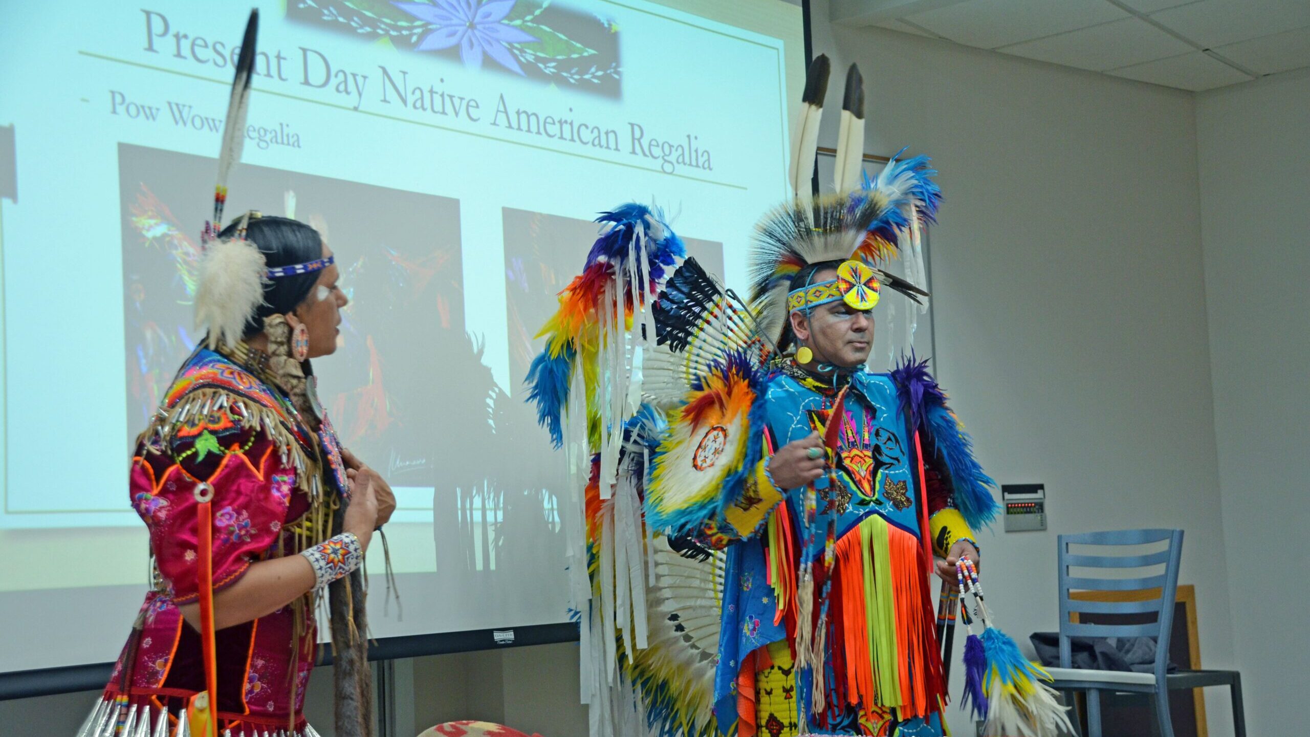 Michelle Reed and James Cohen presenting on traditional Native American Regalia.