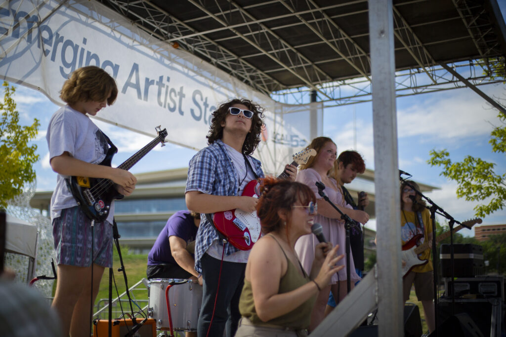 Performers from the Des Moines Music Coalition Summer Camp playing on the Emerging Artist Stage.