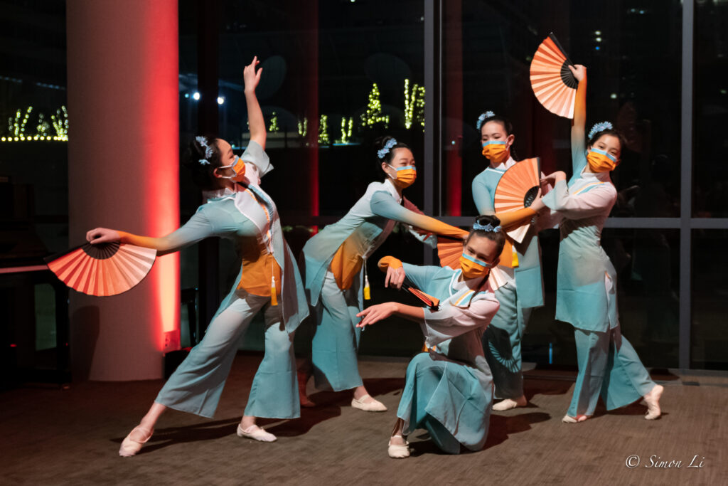 Members of CAAM Chinese Dance Theater perform and pose at a Chinese New Year Celebration.