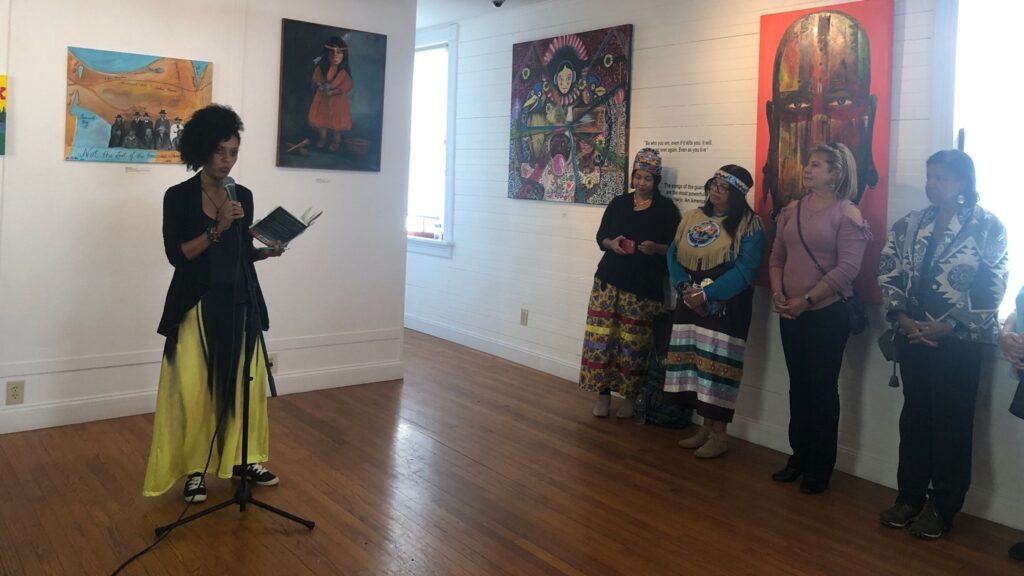 Dominican poet Adriana Devers reading a poem by Joy Harjo as part of the Big Read Kick-Off event.