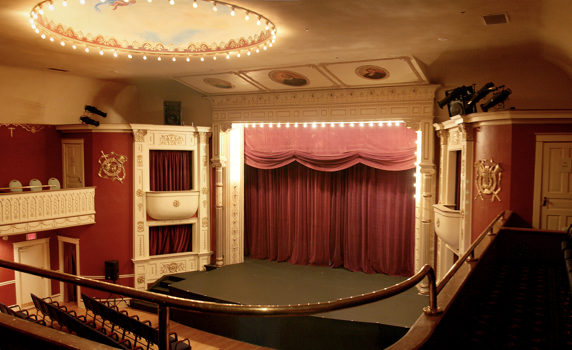 View of the stage from the top balcony in an opera house.