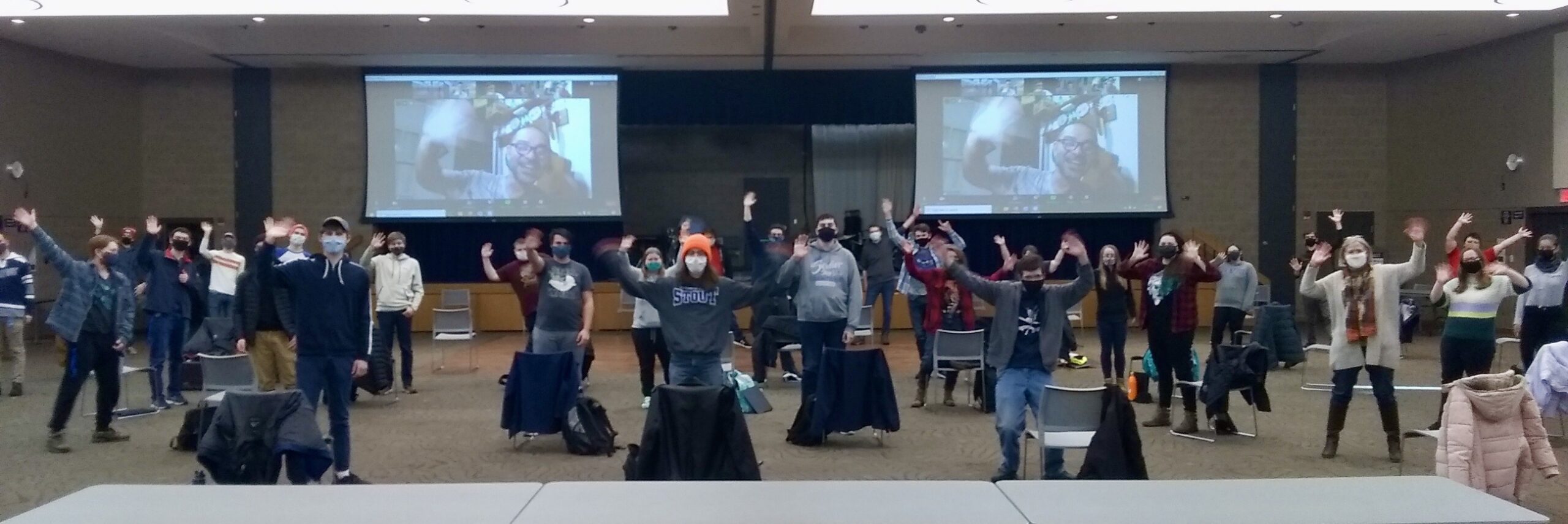UW Stout Students wave during a digital engagement with Paulo Padilha