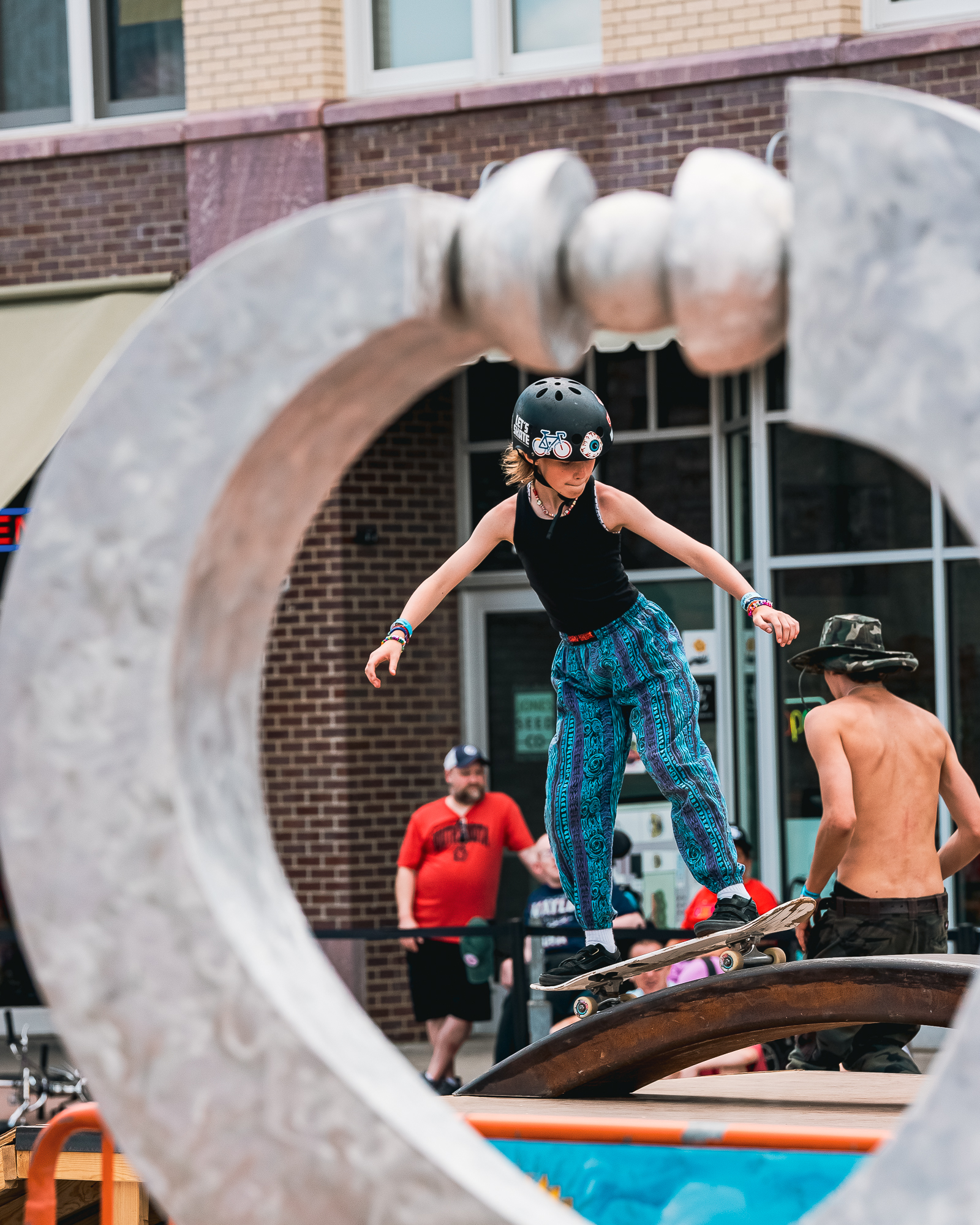 A young skateboarder balances on their board on top of a mini ramp during Innoskate 2022 in Sioux Falls, SD.