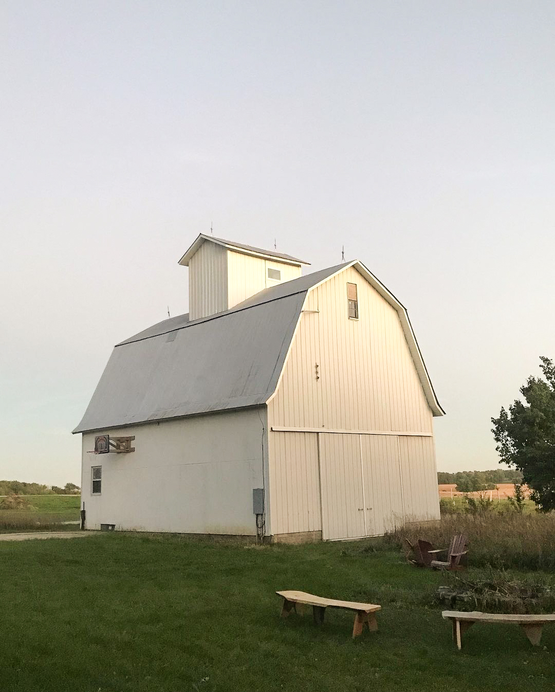 A white barn standing in the countryside