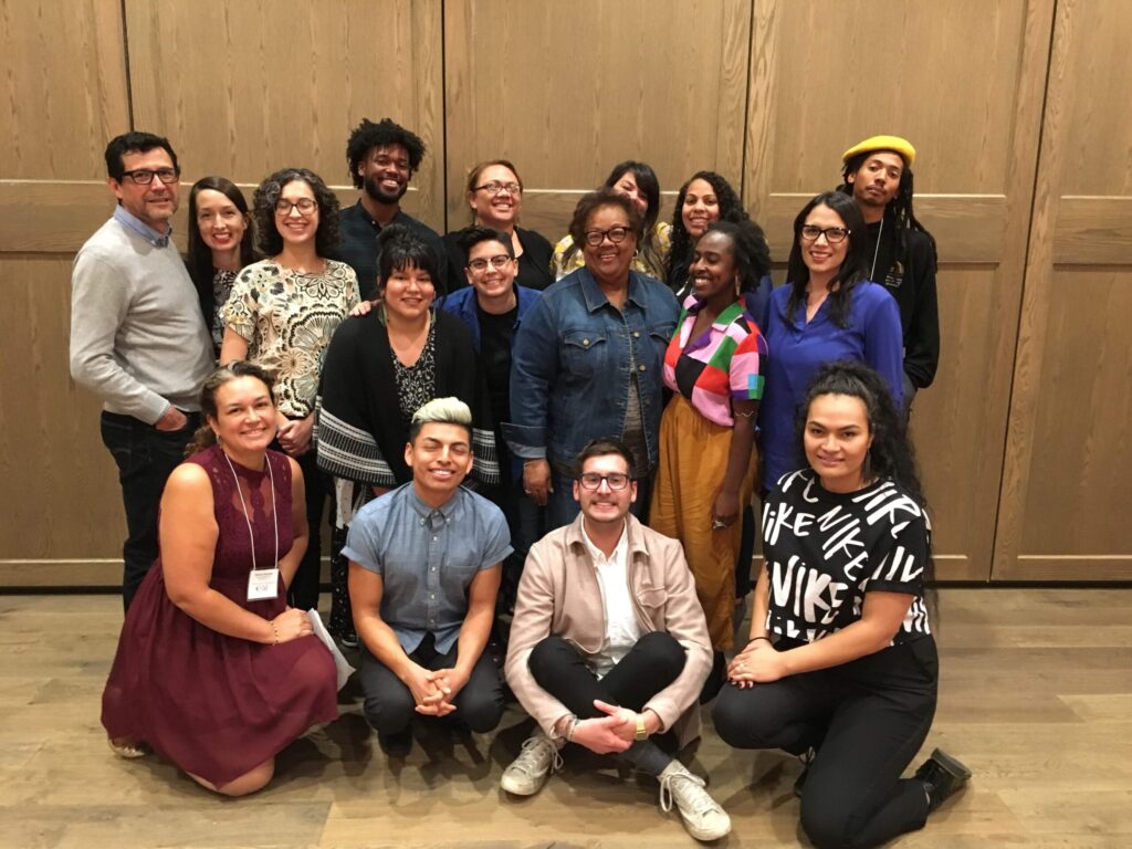 20 of smiling arts administrators of color pose for a group photo