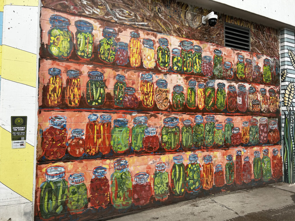 A mural of pickle jars and preserves.