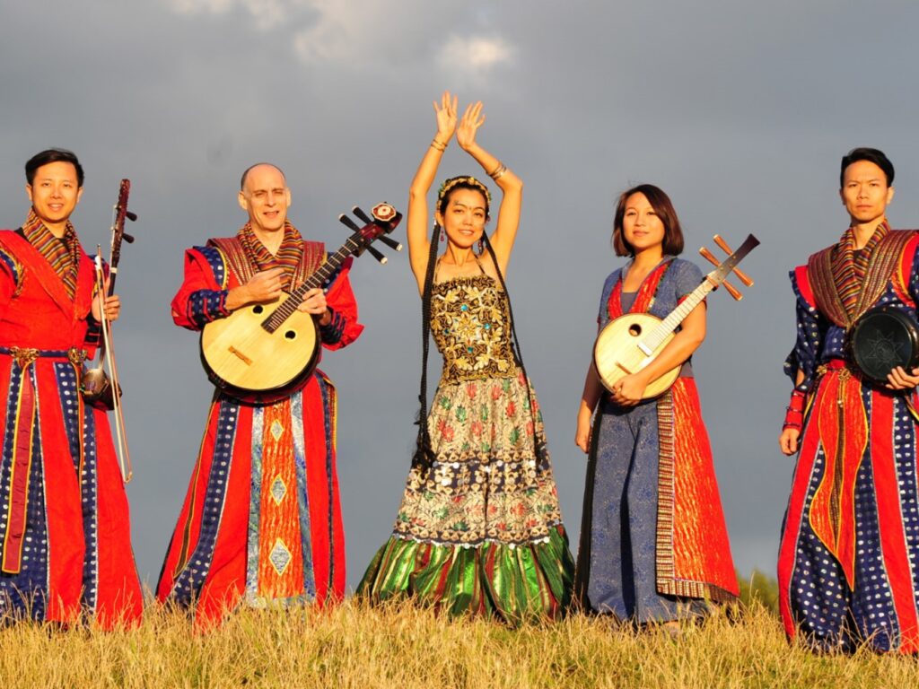 Five people in traditional Taiwanese dress, holding various instruments.