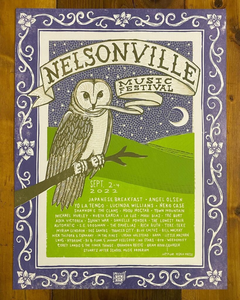 A letterpress poster depicting an owl sitting on a branch, with large text that reads "Nelsonville Music Festival." The poster has an ornate border and other text listing out names of musicians and bands.