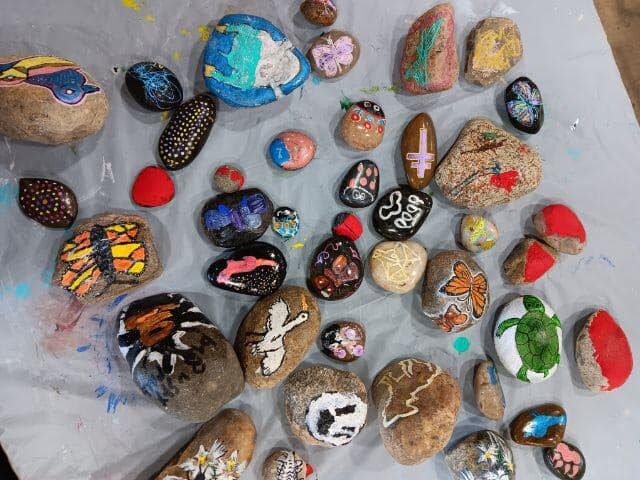 An assortment of colorfully printed rocks