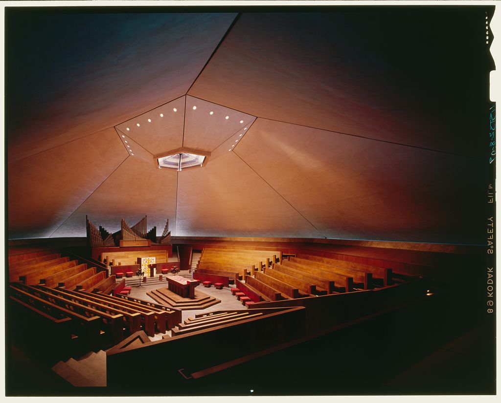 Interior of a church with angular architectural features and details.