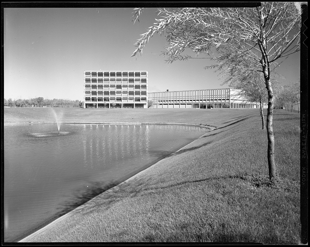 A lake with a building in the background.