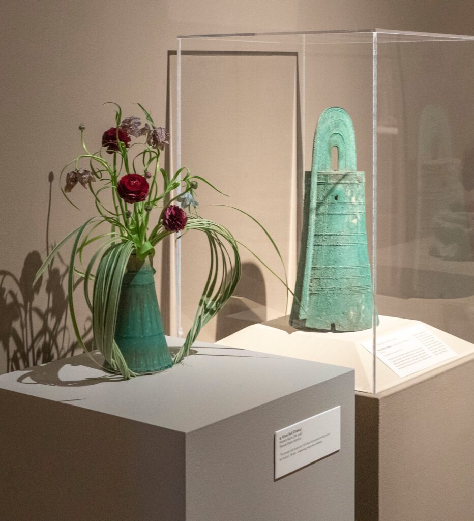 A ritual vase and a flower arrangement interpreting it.