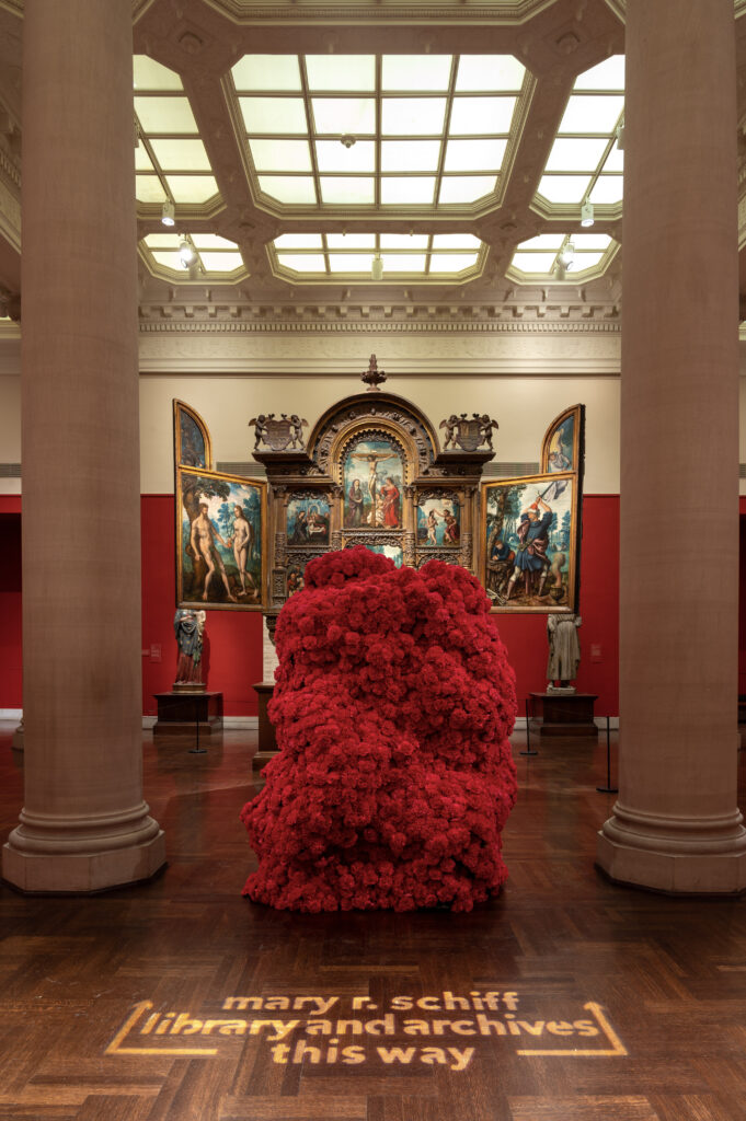 A mass of roses in a gallery