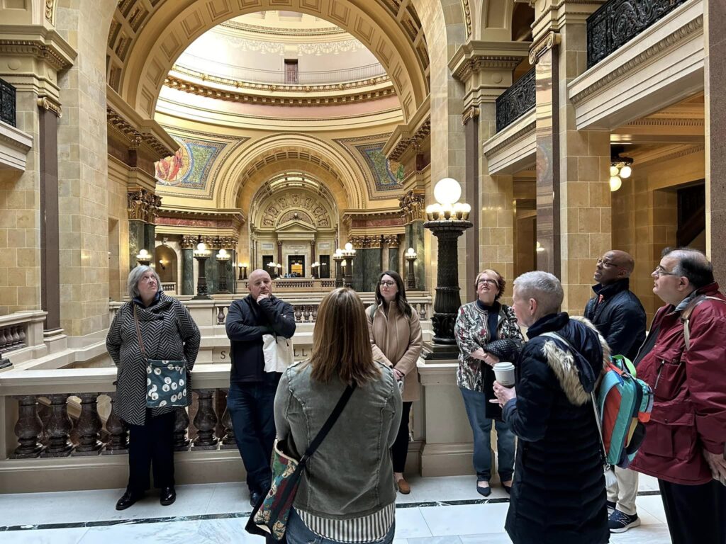 A group of people in Madison's capital house