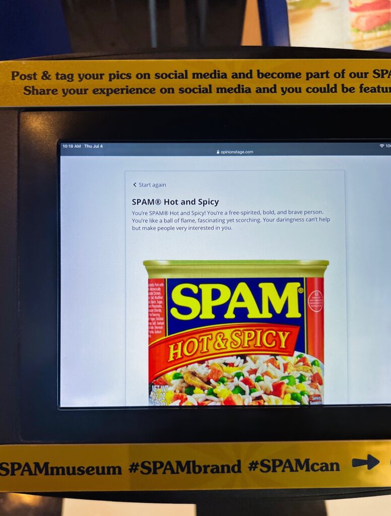 A tablet screen showing a personality result reading, "You're SPAM Hot and Spicy!"