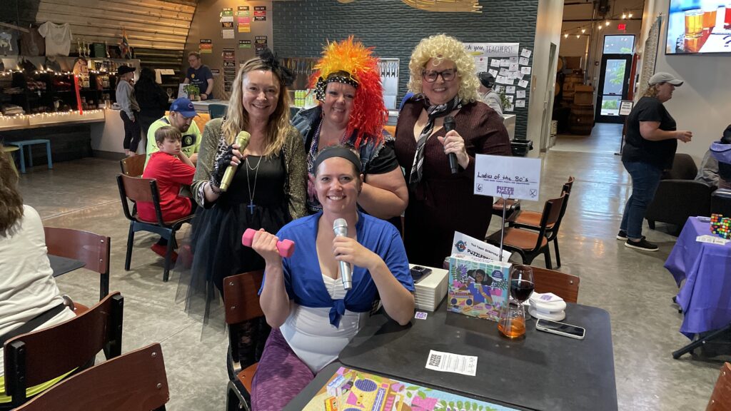 A group of four people dressed in different costumes and accessories.