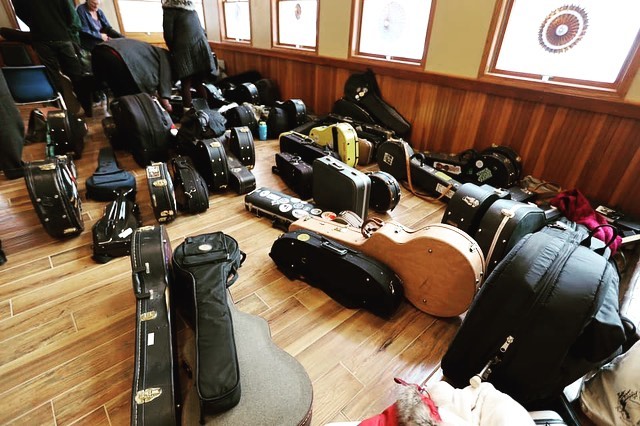 Instrument cases on the floor.