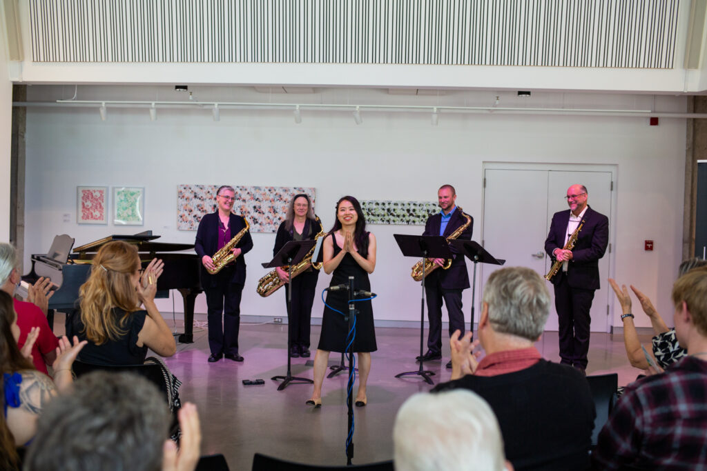 Jazz band receiving applause from audience