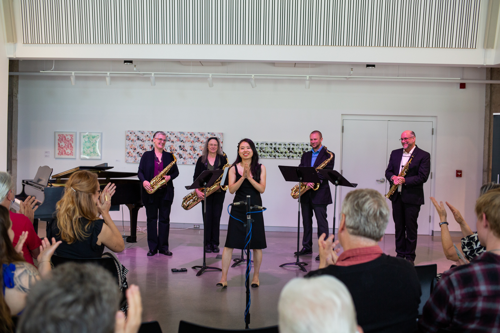 Jazz band receiving applause from audience