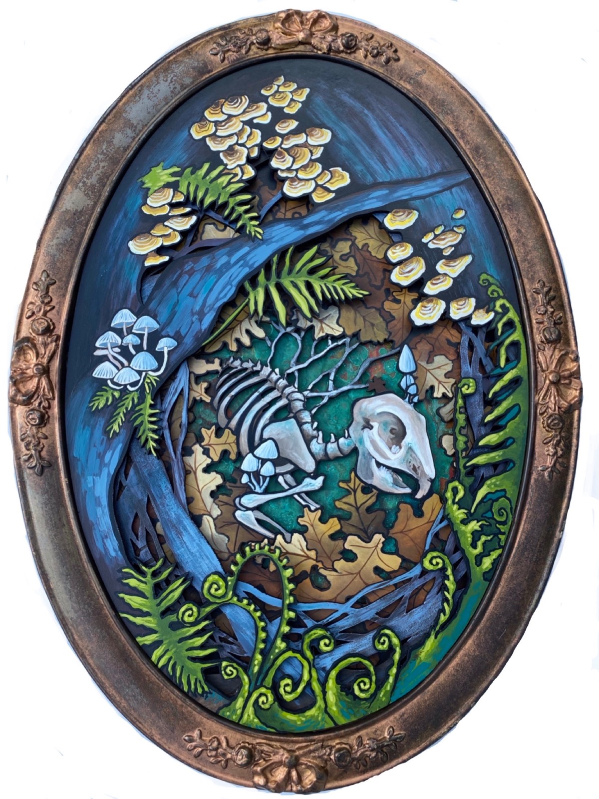 A piece of woodcut artwork depicting a skeleton and flowers inside of an oval.