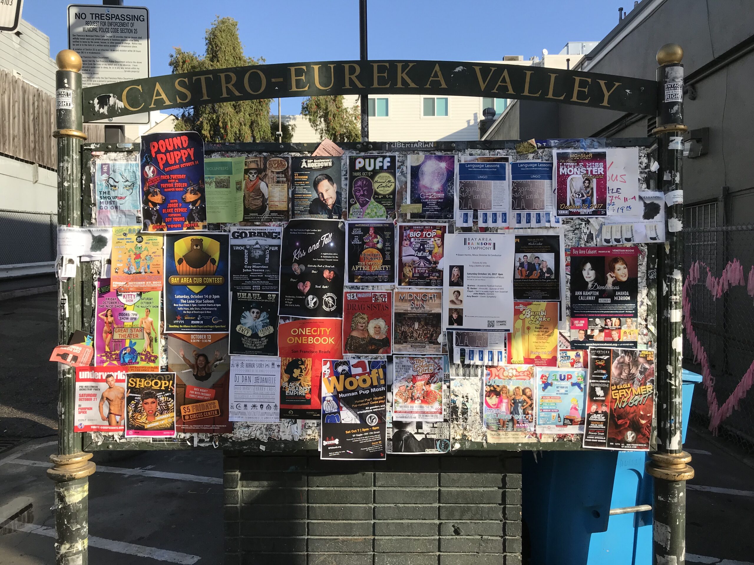 A bulletin board reading, “Castro Eureka Valley,” including approximately 40+ flyers for events like concerts, plays, events, and more.