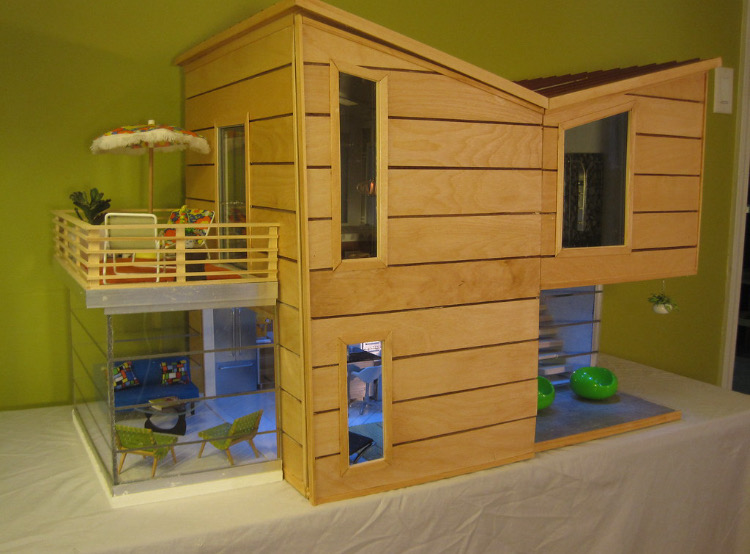A miniature two-story house with a modern design