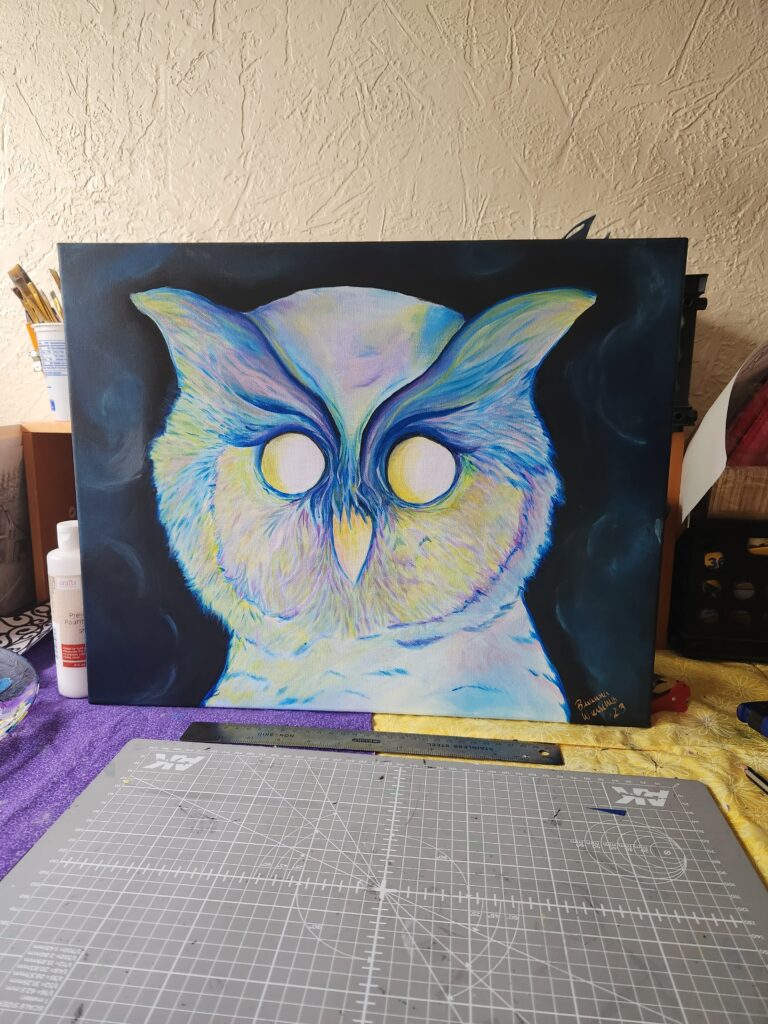 The face of a large pale owl shaded with whites, blues, yellows, purples, and greens, with bright round eyes and tufts of feathers on each side of its head.