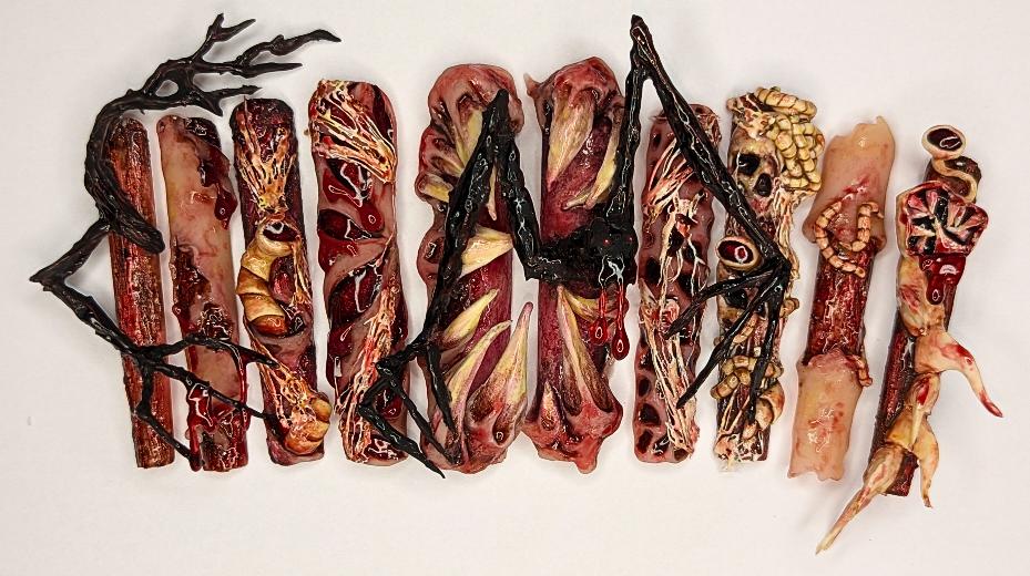 A set of long nails decorated with browns and tans.