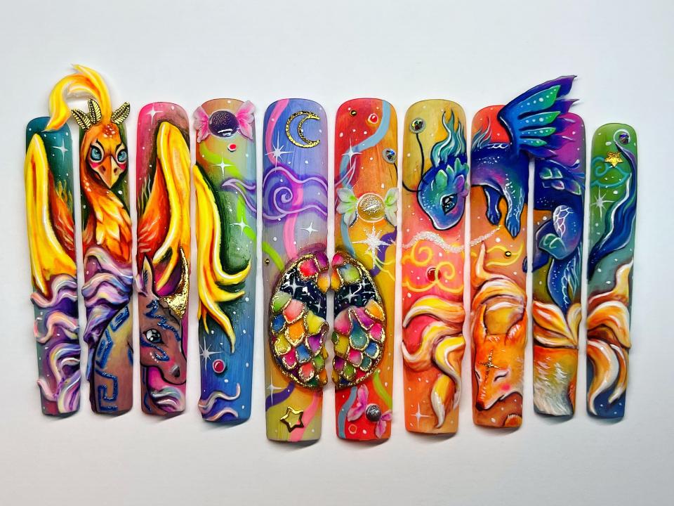 A set of colorfully decorated and long fingernails.