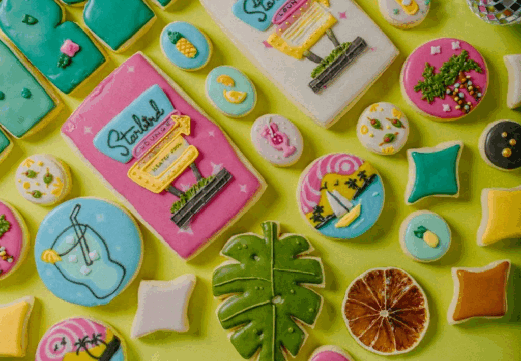 Several colorfully decorated sugar cookies of various sizes and shapes.