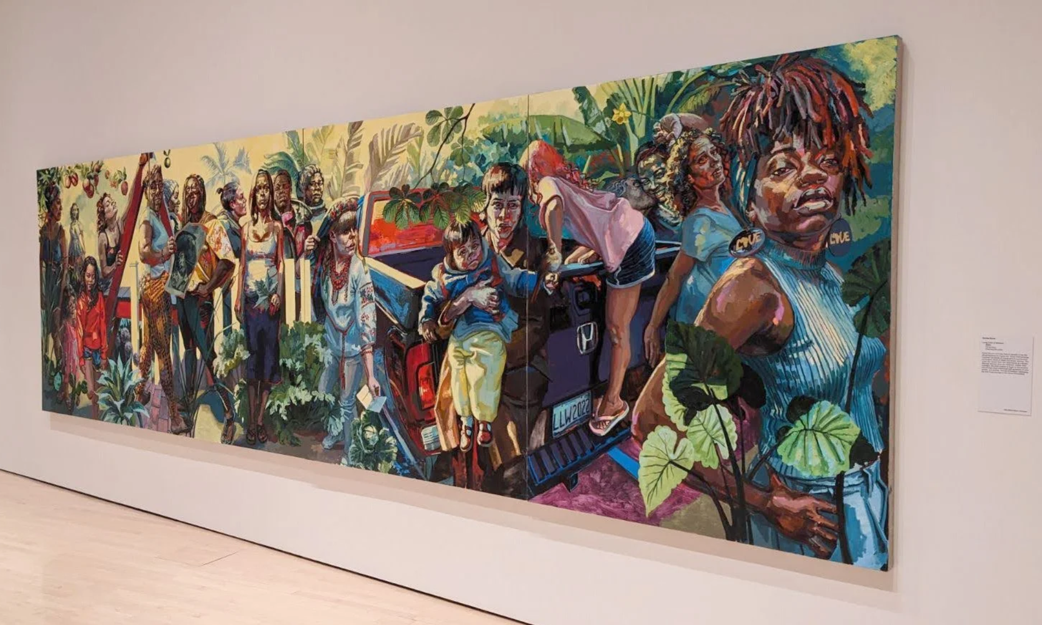 a large, colorful painting of various women doing different activities.