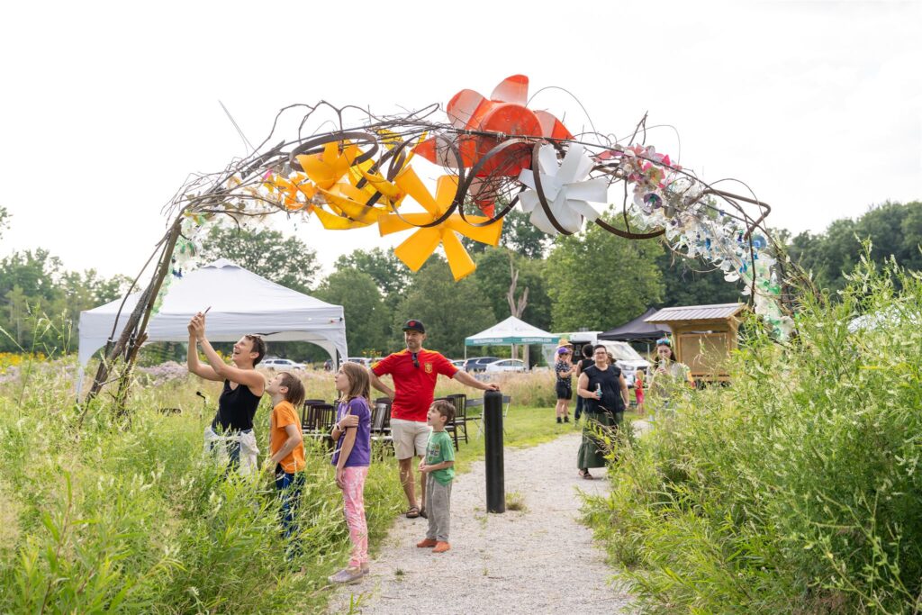 People admiring public art in a park