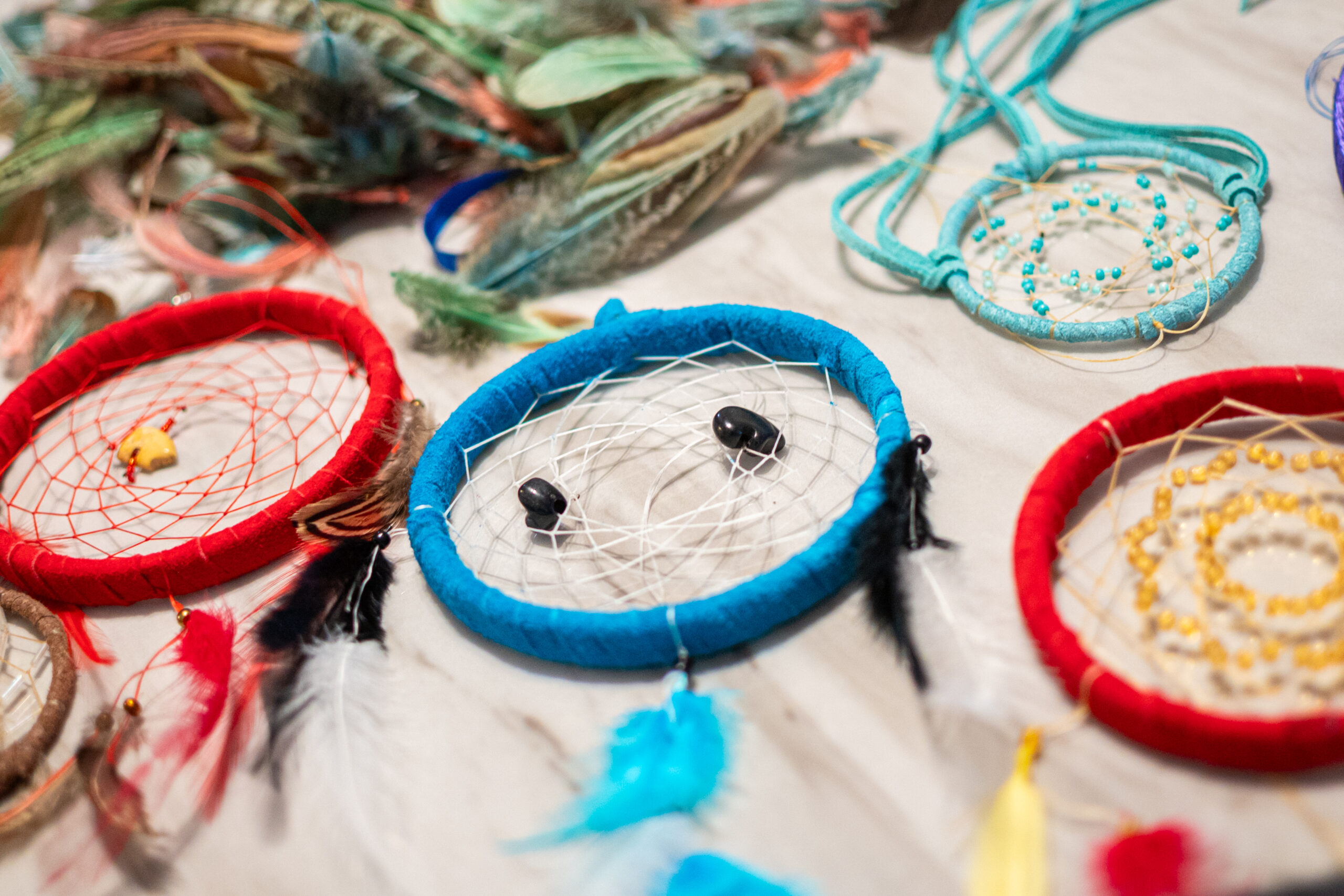 Colorful dreamcatchers laying on a table