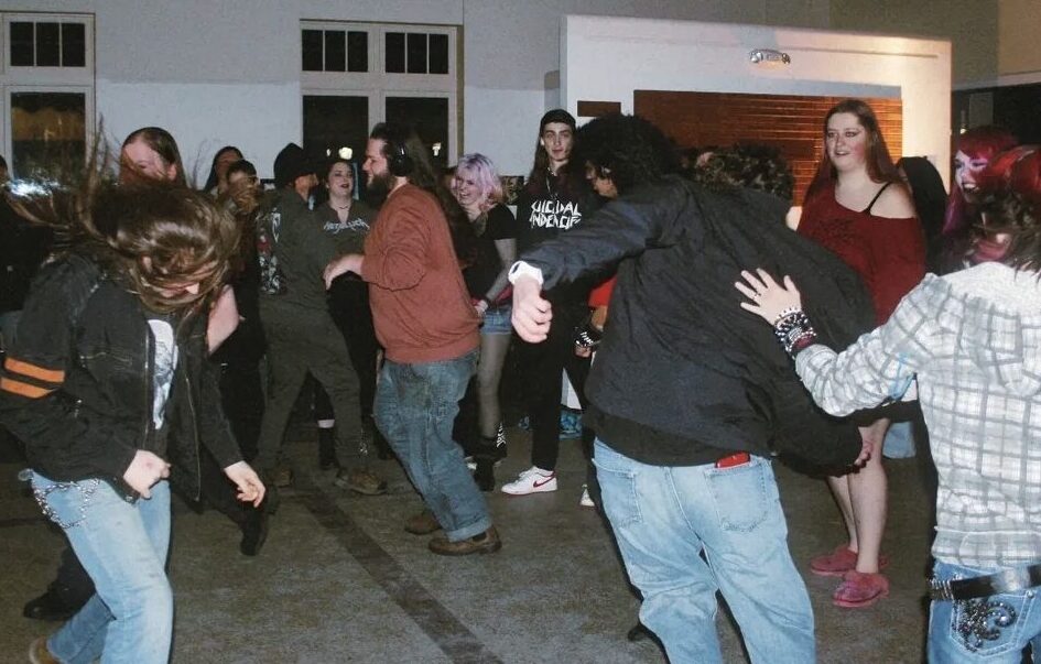 People in a mosh pit inside.