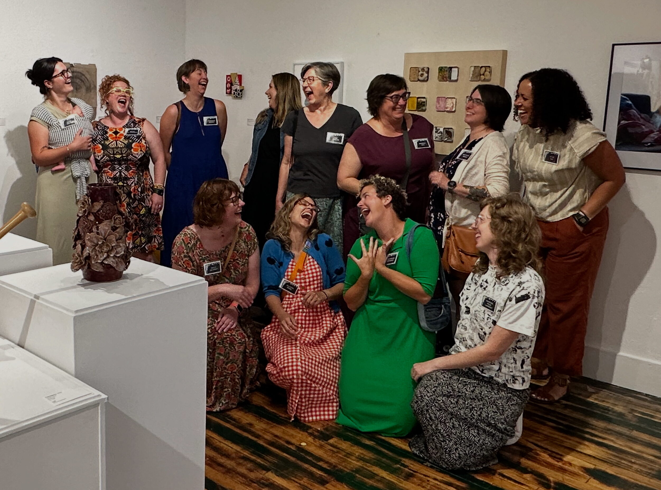 A group of women laughing with each other.